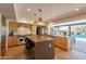 Spacious kitchen featuring a large island, stainless steel appliances, and hardwood flooring at 20 W Canterbury Ln, Phoenix, AZ 85023