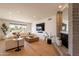Bright and airy living room with fireplace, plush sofa, and ample natural lighting at 20 W Canterbury Ln, Phoenix, AZ 85023