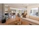 Spacious living room with pool view, fireplace, and an open flow into kitchen and dining area at 20 W Canterbury Ln, Phoenix, AZ 85023
