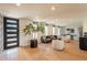 Bright and airy living room with wood floors, modern furnishings, and a view of the outdoors at 20 W Canterbury Ln, Phoenix, AZ 85023