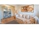 Bright living room with hardwood floors, modern art, comfortable sofa, and ample storage at 20 W Canterbury Ln, Phoenix, AZ 85023
