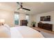 The bright main bedroom is enhanced by two windows and tasteful decor at 20 W Canterbury Ln, Phoenix, AZ 85023