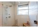 Modern shower with a rain showerhead and glass door at 20 W Canterbury Ln, Phoenix, AZ 85023