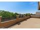 Wide-open, outdoor balcony features neutral stucco walls, dark wrought iron railings, and beautiful neighborhood views at 20483 E Mockingbird Dr, Queen Creek, AZ 85142