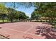 Community basketball court surrounded by lush greenery, offering residents a great space for exercise and recreation at 20483 E Mockingbird Dr, Queen Creek, AZ 85142