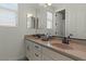 Well-lit bathroom features double sinks, a large mirror, neutral walls, and great natural light at 20483 E Mockingbird Dr, Queen Creek, AZ 85142