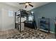 Stylish bedroom featuring a unique loft bed, modern decor, and plenty of storage space at 20483 E Mockingbird Dr, Queen Creek, AZ 85142