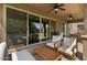 Stylish covered patio with ample seating, ceiling fans, and seamless indoor-outdoor living at 20483 E Mockingbird Dr, Queen Creek, AZ 85142