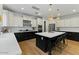 A modern kitchen features an island, stainless steel appliances, pendant lighting, and white subway tile backsplash at 20483 E Mockingbird Dr, Queen Creek, AZ 85142