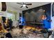 Music room with a drum set, guitars, a keyboard, black accent wall, and natural light at 20483 E Mockingbird Dr, Queen Creek, AZ 85142