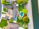 Aerial view of the property showing the pool, lush backyard, and landscaping, all bordering a local canal at 2066 E Lockwood St, Mesa, AZ 85213