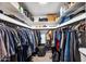 Walk-in closet with ample storage space, shelving, and hanging rods for organized storage at 2066 E Lockwood St, Mesa, AZ 85213
