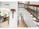 Bright, airy foyer with a staircase, tile flooring, and an open view to the dining and living area at 2066 E Lockwood St, Mesa, AZ 85213
