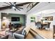 Bright living area with high ceilings, sleek furniture, a decorative fan, and a dining area nearby at 2066 E Lockwood St, Mesa, AZ 85213