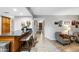 Stylish living area featuring a kitchen bar with seating, seamlessly blending with the open-concept living space at 2066 E Lockwood St, Mesa, AZ 85213