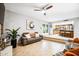 Open concept living room with tile flooring, access to the kitchen, with gray sofa and bright natural light at 2066 E Lockwood St, Mesa, AZ 85213