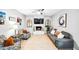 Cozy living room featuring a decorative fireplace, tile flooring, modern furniture, and natural light at 2066 E Lockwood St, Mesa, AZ 85213