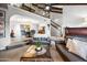 Open-concept living area featuring sleek furniture, high ceilings, a staircase and views to the dining area at 2066 E Lockwood St, Mesa, AZ 85213