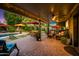 Covered patio with ceiling fan, lights, seating, and a view of the pool and backyard at 2066 E Lockwood St, Mesa, AZ 85213