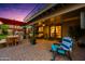 Expansive brick patio with outdoor seating, dining area, and ambient lighting for relaxing evenings at 2066 E Lockwood St, Mesa, AZ 85213