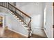 Carpeted staircase with wood railing and decorative trim adds warmth and character at 2066 E Lockwood St, Mesa, AZ 85213