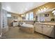 Luxurious bathroom featuring a soaking tub, walk-in shower, and dual vanities at 20791 W Main St, Buckeye, AZ 85396