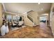 Bright dining room with view to front yard and staircase with decorative iron railing at 20791 W Main St, Buckeye, AZ 85396