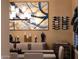 View of dining room featuring modern chandelier, large painting, and a wall-mounted wine rack at 20791 W Main St, Buckeye, AZ 85396