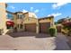 Spacious home with a three-car garage, well-manicured landscaping, and paved driveway at 20791 W Main St, Buckeye, AZ 85396