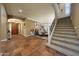 Grand foyer featuring decorative tile flooring, staircase, and elegant dining area at 20791 W Main St, Buckeye, AZ 85396