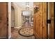 Elegant foyer featuring custom tile flooring, a decorative light fixture, and a grand entrance at 20791 W Main St, Buckeye, AZ 85396