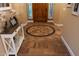Foyer with decorative tile flooring and a view of the wood front door at 20791 W Main St, Buckeye, AZ 85396
