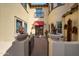 Charming front entrance with brick walkway, desert landscaping, and a stylish red awning at 20791 W Main St, Buckeye, AZ 85396