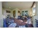 Spacious front porch featuring multiple seating areas, providing a welcoming outdoor space at 20791 W Main St, Buckeye, AZ 85396