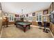 Entertainment room with a pool table, a TV, and neutral walls, perfect for recreation at 20791 W Main St, Buckeye, AZ 85396