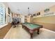Recreation room with a pool table and two-tone paint, with fan signs, great for entertaining guests at 20791 W Main St, Buckeye, AZ 85396
