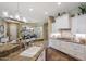 Kitchen with granite countertops, white cabinets, and stainless steel appliances at 20791 W Main St, Buckeye, AZ 85396