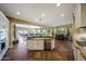 Kitchen overlooking the backyard, Gathering room and dining room creating an open concept at 20791 W Main St, Buckeye, AZ 85396