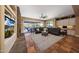 Spacious living room with a stone fireplace and backyard views at 20791 W Main St, Buckeye, AZ 85396