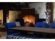 Cozy outdoor fireplace with comfortable seating, perfect for cool evenings and entertaining guests at 20791 W Main St, Buckeye, AZ 85396