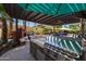 Gourmet outdoor kitchen featuring a built-in grill, pizza oven, and bar perfect for entertaining guests at 20791 W Main St, Buckeye, AZ 85396