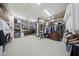 Massive walk-in closet with custom shelving, clothing racks, and ample storage space at 20791 W Main St, Buckeye, AZ 85396