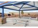 Outdoor pavilion with picnic tables, barbecue, and seating area for community events at 25348 W Bowker St, Buckeye, AZ 85326