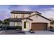 Charming two-story home with a two car garage and nicely landscaped front yard at 25348 W Bowker St, Buckeye, AZ 85326