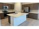 Bright kitchen with a large center island, stainless steel appliances and modern cabinetry at 25348 W Bowker St, Buckeye, AZ 85326