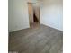 Inviting living room with tile flooring and an open staircase, providing a bright and airy space at 25348 W Bowker St, Buckeye, AZ 85326