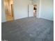 Spacious bedroom with an open layout and neutral carpeting at 25354 W Bowker St, Buckeye, AZ 85326
