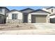 Charming single story home featuring stone accents and a neutral color palette for a modern and inviting curb appeal at 25354 W Bowker St, Buckeye, AZ 85326