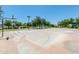 Community basketball court with lush green trees and lawn in the background at 2749 S Powell Rd, Apache Junction, AZ 85119