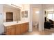 Spacious bathroom with vanity, toilet, and a partial view of a walk-in closet at 2749 S Powell Rd, Apache Junction, AZ 85119